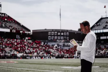 Head coach Jeff Hafley looks at his notes/plays before Boston College vs Rutgers.