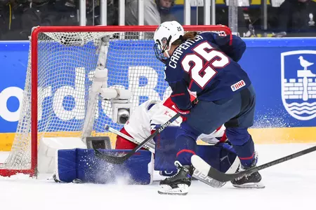 Alex Carpenter drives to the net against Czechia.
