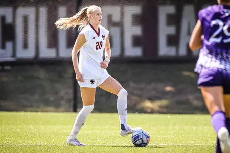 Ragna Magnusdottir looks to dribble the ball up field against Holy Cross.