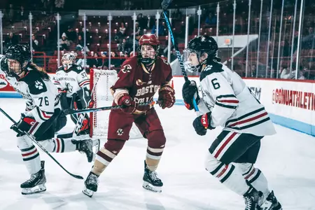 Abby Newhook skates. behind the net at Northeastern.