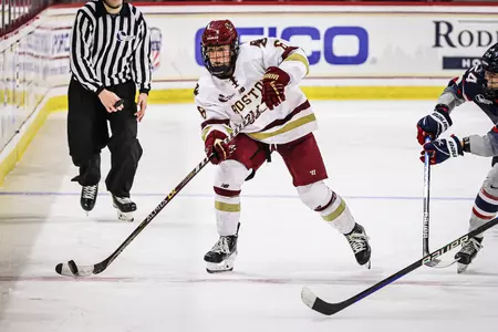 Kiley Erickson dumps the puck across the red line.