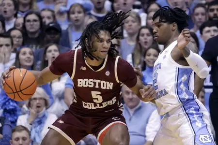 Boston College guard DeMarr Langford Jr. (5) works the ball against North Carolina guard Caleb Love (2) during the first half of an NCAA college basketball game Tuesday, Jan. 17, 2023, in Chapel Hill, N.C. (AP Photo/Chris Seward)