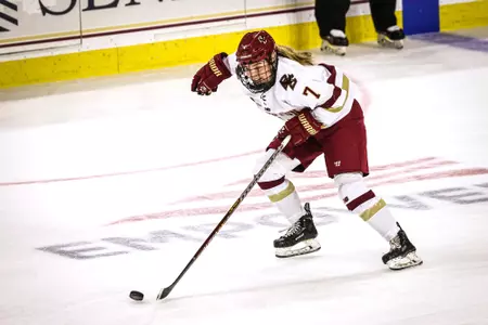 Kate Ham skates the puck up the ice.