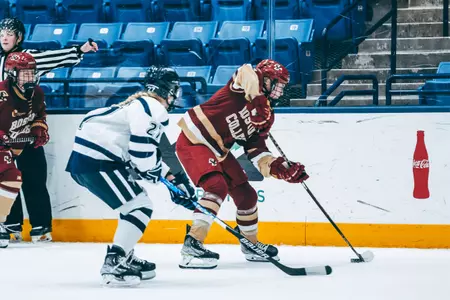 Kara Goulding carries the puck into the zone.