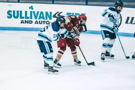 Kelly Browne looks to shoot the puck at Maine.