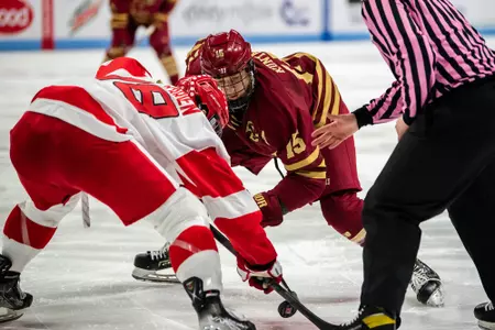 Trevor Kuntar takes a faceoff against BU