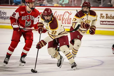 Christian O'Neill skates with the puck against BU