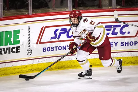 Abby Newhook carries the puck out of the corner.