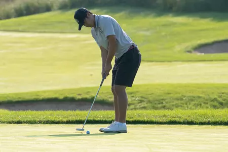 Boston College Men's Golf - Markus Lam lines up a putt