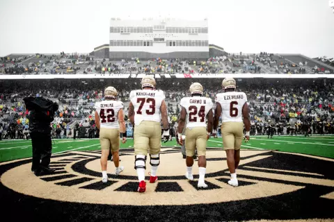 Captains walk to midfield at Army.