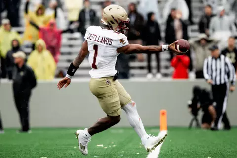 Thomas Castellanos hands the ball to the ref in the end zone at Army.