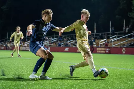 Alfie Hughes holds possession against Yale