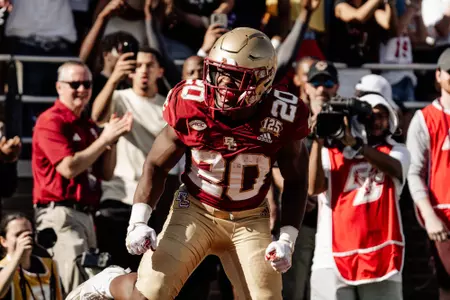 Alex Broome celebrates after receiving touchdown