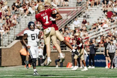 Sione Hala celebrates with teammate after big stop