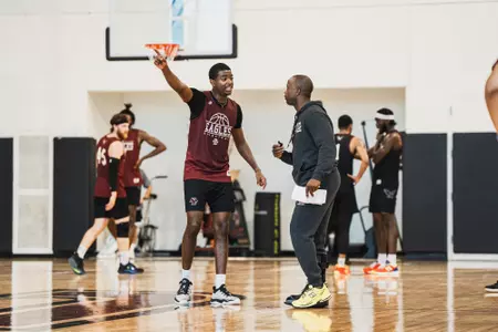 Head coach Earl Grant and guard Chas Kelley III at practice at the Hoag Basketball Pavilion