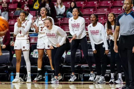 Ally VanTimmeren and Savannah Samuel celebrating on the bench
