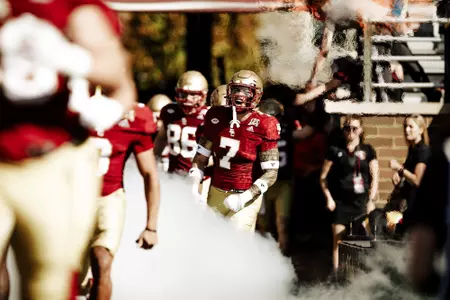 Sione Hala and the Eagles run out of the tunnel prior to the UConn game.