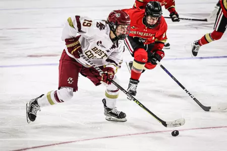 Hannah Bilka carries the puck in the offensive zone against Northeastern.