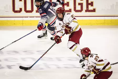 Abby Newhook carries the puck through the neutral zone against UConn.