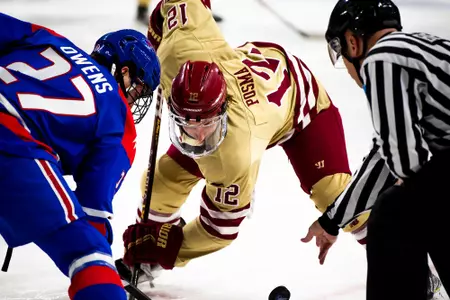 Mike Posma takes a faceoff against Lowell