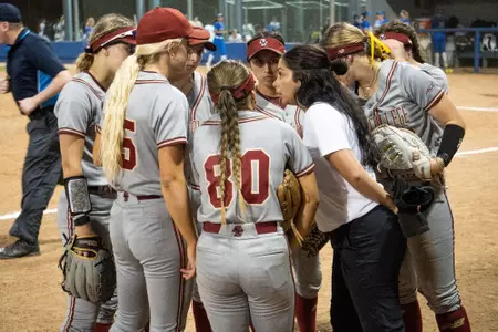 BC Softball huddles during game against Middle Tennessee