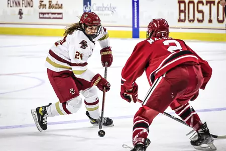 Caroline Goffredo carries the puck over the blue line against Harvard.
