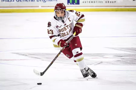 Cayla Barnes carries the puck over the blue line.