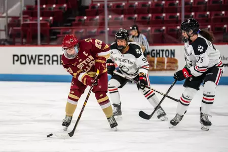 Cayla Barnes carries the puck through the neutral zone.