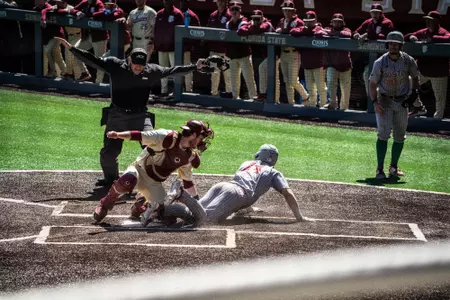 Vince Cimini slides in safely to home plate at Florida State