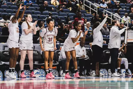The bench celebrates during the first round of the ACC Tournament