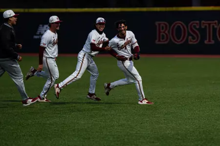 Vince Cimini chased down by his teammates after a walk-off hit vs. Sacred Heart