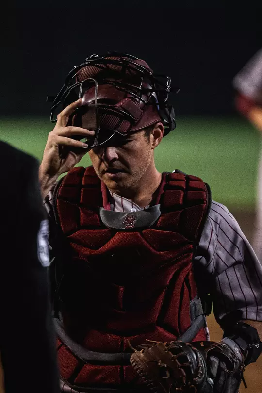 Peter Burns adjusts his facemask at Tennessee