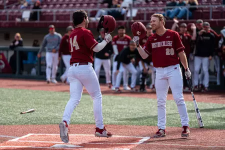 Vince Cimini is greeted at home plate by Barry Walsh after his home run vs. Georgia Tech.