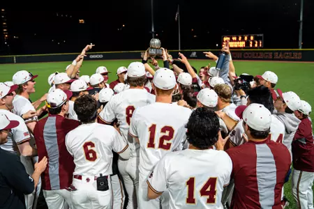 Eagles players hold the Beanpot up in victory.