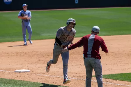 Travis Honeyman rounds third after a home run at UNC.