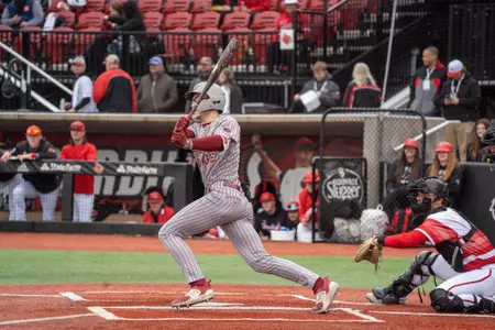 Travis Honeyman swings vs. Louisville.