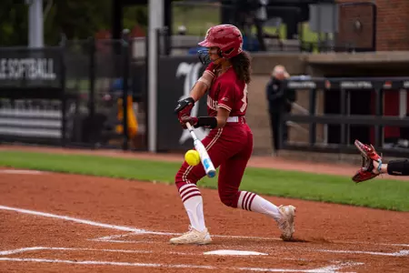 Aleyah Terrell swings during at bat against Louisville