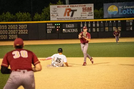 Sam McNulty throws from second base to turn a double play at Wake Forest.