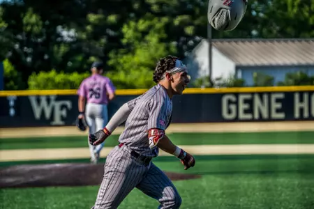 Cohl Mercado flips his helmet in the air as he runs into the dugout after a game-tying home run.