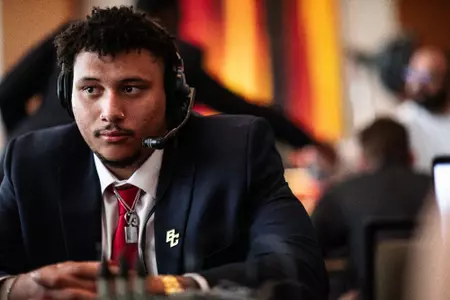 Christian Mahogany on headset during a radio interview at the 2023 ACC Kickoff.