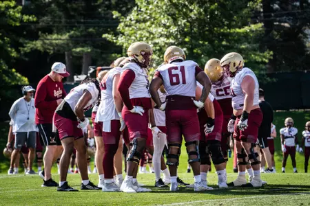 The BC offense in the huddle.