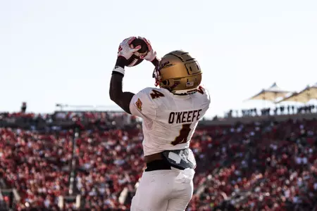 Ryan O'Keefe goes up for a touchdown reception at Louisville.