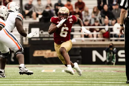 Donovan Ezeiruaku charges in for the sack vs. Virginia