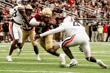 Thomas Castellanos jukes a Virginia defender for the first down