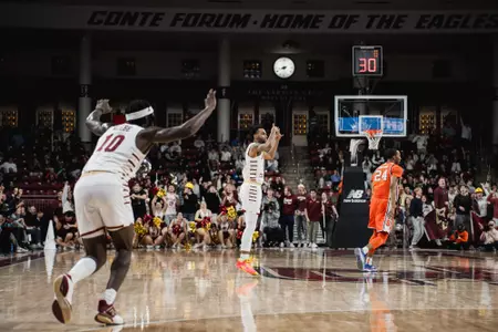Claudell Harris Jr. celebrates a triple vs. Syracuse