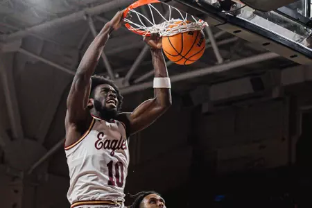 Boston College's Prince Aligbe dunks the ball