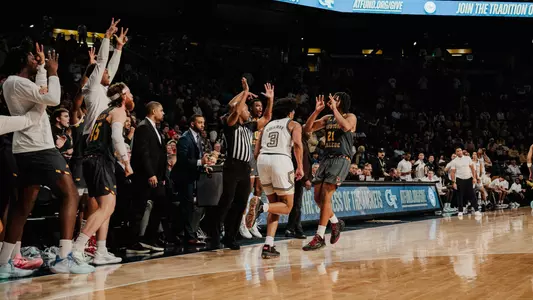 Devin McGlockton celebrates a three
