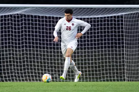 Marc Boye passing the ball against Suffolk