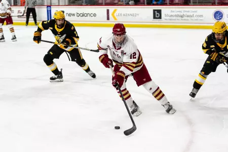 Mike Posma skating with puck