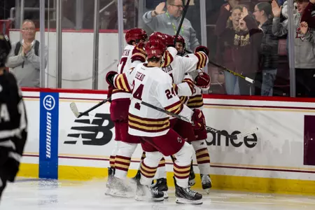 Men's Hockey celebrating against Western Michigan